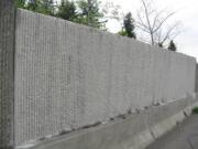 A group of local volunteers charged with removing graffiti on state highways often respond quickly to paint over targeted locations, including this newly cleaned spot along state Highway 500 in Vancouver.