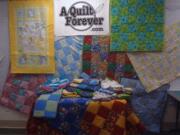 Battle Ground: Some of the 30-plus quilts donated to Babies in Need by a group of four Battle Ground women.