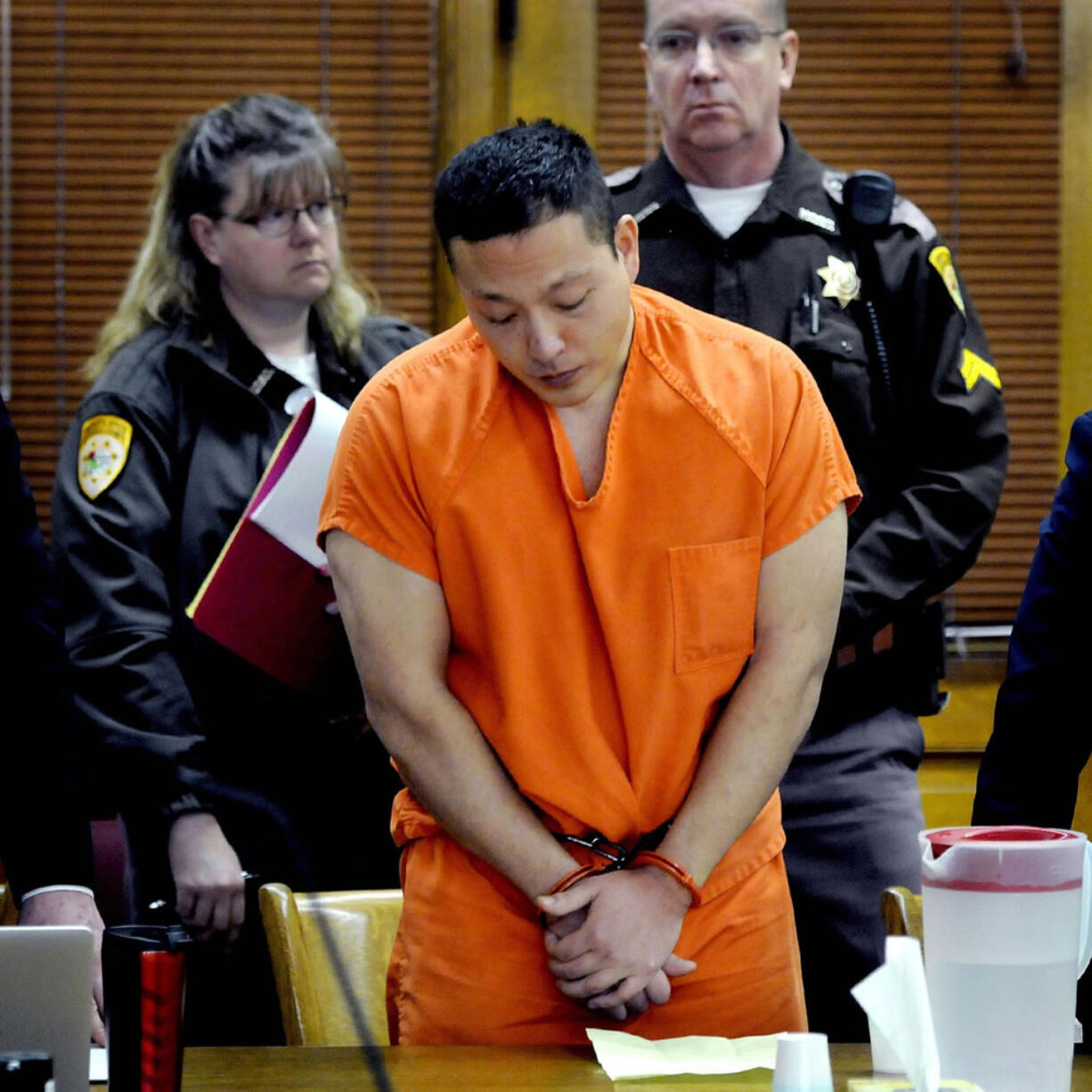 Markus Kaarma stands in Missoula County, Mont., District Court while Judge Ed McLean sentences him to 70 years in prison for the shooting death of German exchange student Diren Dede last year.