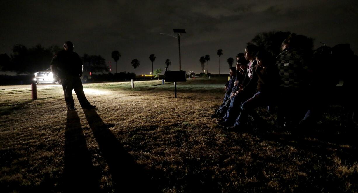 A group of immigrants from Honduras and El Salvador who crossed the U.S.-Mexico border illegally are stopped in Granjeno, Texas.