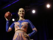 Katy Perry shows off her dress at a news conference Thursday for the halftime show of Super Bowl XLIX. (AP Photo/David J.