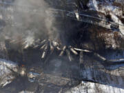 In this aerial photo made available by the Office of the Governor of West Virginia shows a derailed train in Mount Carbon, WV., Tuesday.