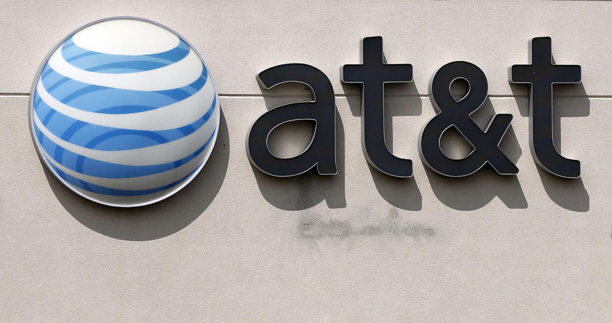 An AT&amp;T logo on a store in Dedham, Mass.