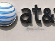 An AT&amp;T logo on a store in Dedham, Mass.