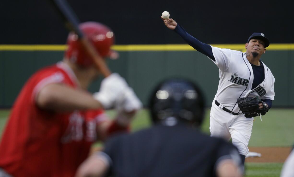 Seattle Mariners starting pitcher Felix Hernandez throws against Los Angeles Angels' Albert Pujols during the fourth inning Thursday, July 9, 2015, in Seattle. (AP Photo/Ted S.