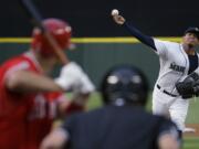 Seattle Mariners starting pitcher Felix Hernandez throws against Los Angeles Angels' Albert Pujols during the fourth inning Thursday, July 9, 2015, in Seattle. (AP Photo/Ted S.