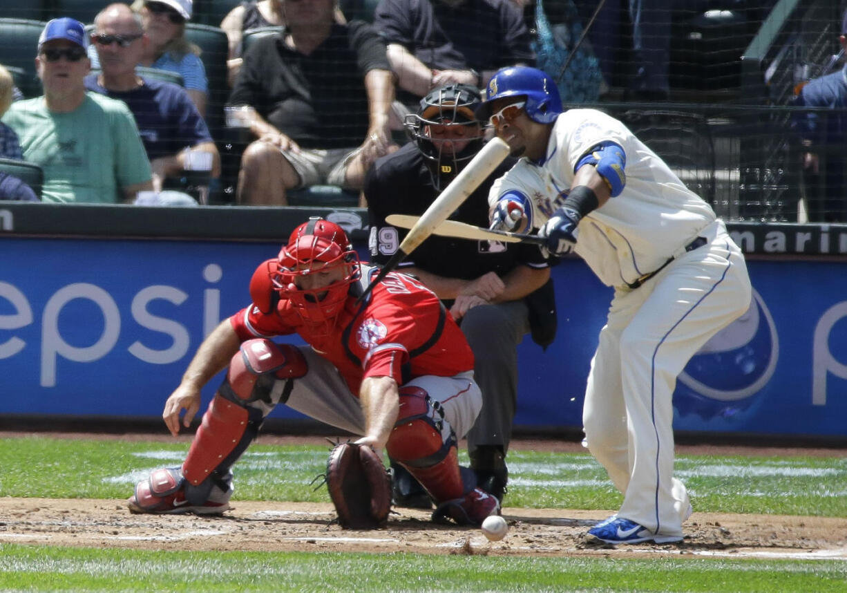 Seattle 's Nelson Cruz breaks his bat against the Los Angeles Angels on July 12 in Seattle.