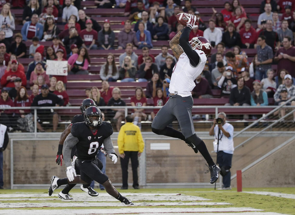 Washington State receiver Vince Mayle, right, has set single-season school records for catches (101) and receiving yards (1,405).