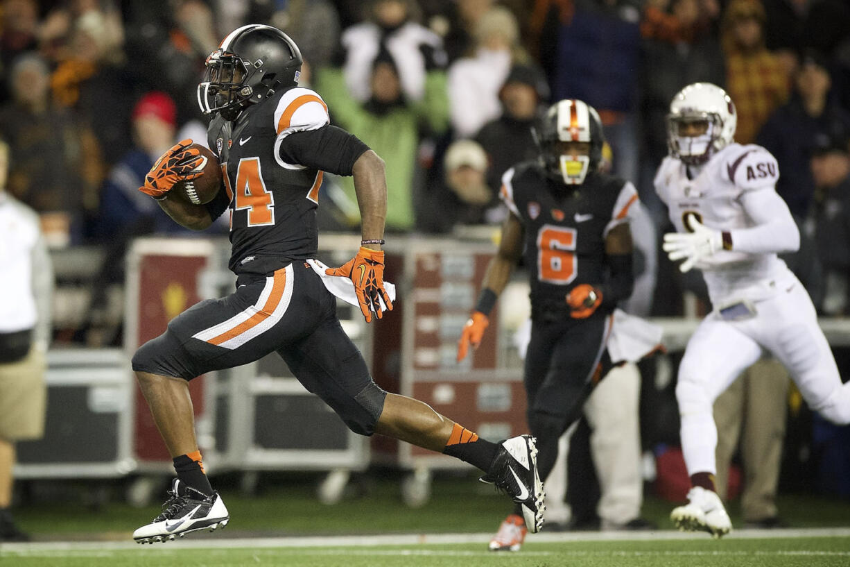 Oregon State tailback Storm Woods (24) scores a touchdown against Arizona State during the first quarter  in Corvallis, Ore., Saturday, Nov. 15, 2014.