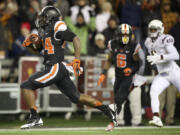 Oregon State tailback Storm Woods (24) scores a touchdown against Arizona State during the first quarter  in Corvallis, Ore., Saturday, Nov. 15, 2014.