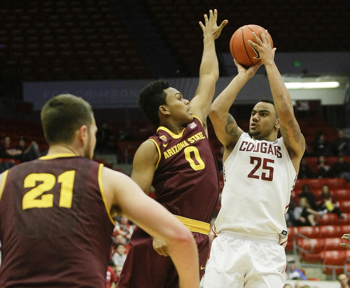 Washington State guard DaVonte' Lacy (25) hits a 3 pointer over Arizona State guard Tra Holder (0) during the second half Friday, Feb 13, 2015, in Pullman.