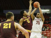 Washington State guard DaVonte' Lacy (25) hits a 3 pointer over Arizona State guard Tra Holder (0) during the second half Friday, Feb 13, 2015, in Pullman.