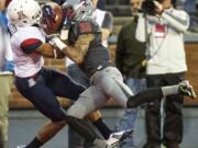 Arizona wide receiver Trey Griffey (5) catches touchdown pass while defended by Washington State cornerback Kevin Griffin (38) during the third quarter Saturday, Oct. 25, 2014, at Martin Stadium in Pullman, Wash. Arizona won 59-37.