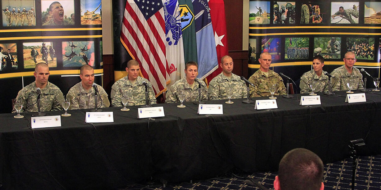 Fielding questions during a press conference Thursday at Fort Benning Ga., are, from left, 2nd Lt. Erickson D. Krogh, 2nd Lt. Anthony Rombold, 2nd Lt. Michael V. Janowski, 1st Lt. Shaye L. Haver, Staff Sgt. Michael C. Calderon, Spec. Christopher J. Carvalho, Capt. Kristen M. Griest and 2nd Lt. Zachary Hagner.