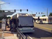 A Bus Rapid Transit vehicle stops on the side of East Fourth Plain Boulevard at Grand Boulevard in this artist's rendition of C-Tran's proposed system.