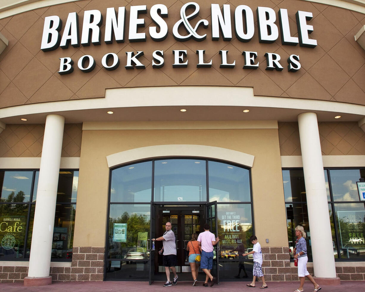 Associated Press files
Customers enter a Barnes