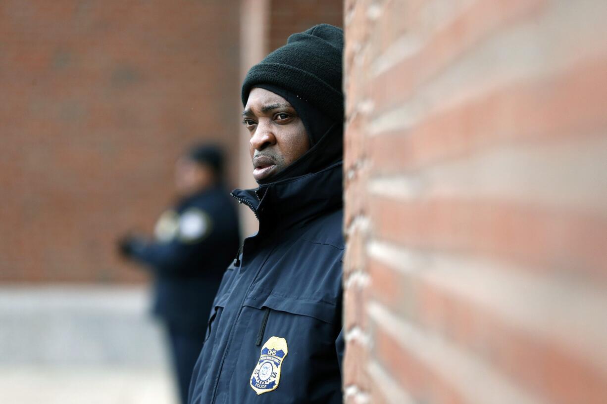 A Department of Homeland Security officer stands guard outside federal court Thursday in Boston, during the federal death penalty trial of Dzhokhar Tsarnaev, who is charged with conspiring with his brother to place two bombs near the Boston Marathon finish line that killed three and injured 260 people in April 2013.