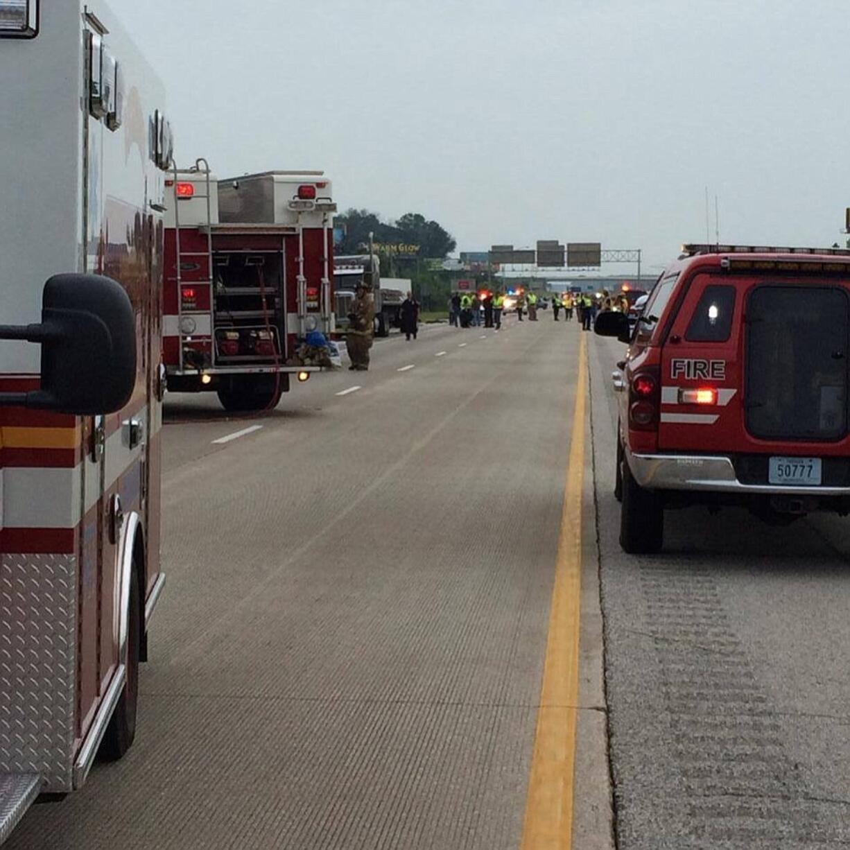 Emergency personnel respond to the scene of a bus accident Sunday on Interstate 70 near Richmond, Ind.