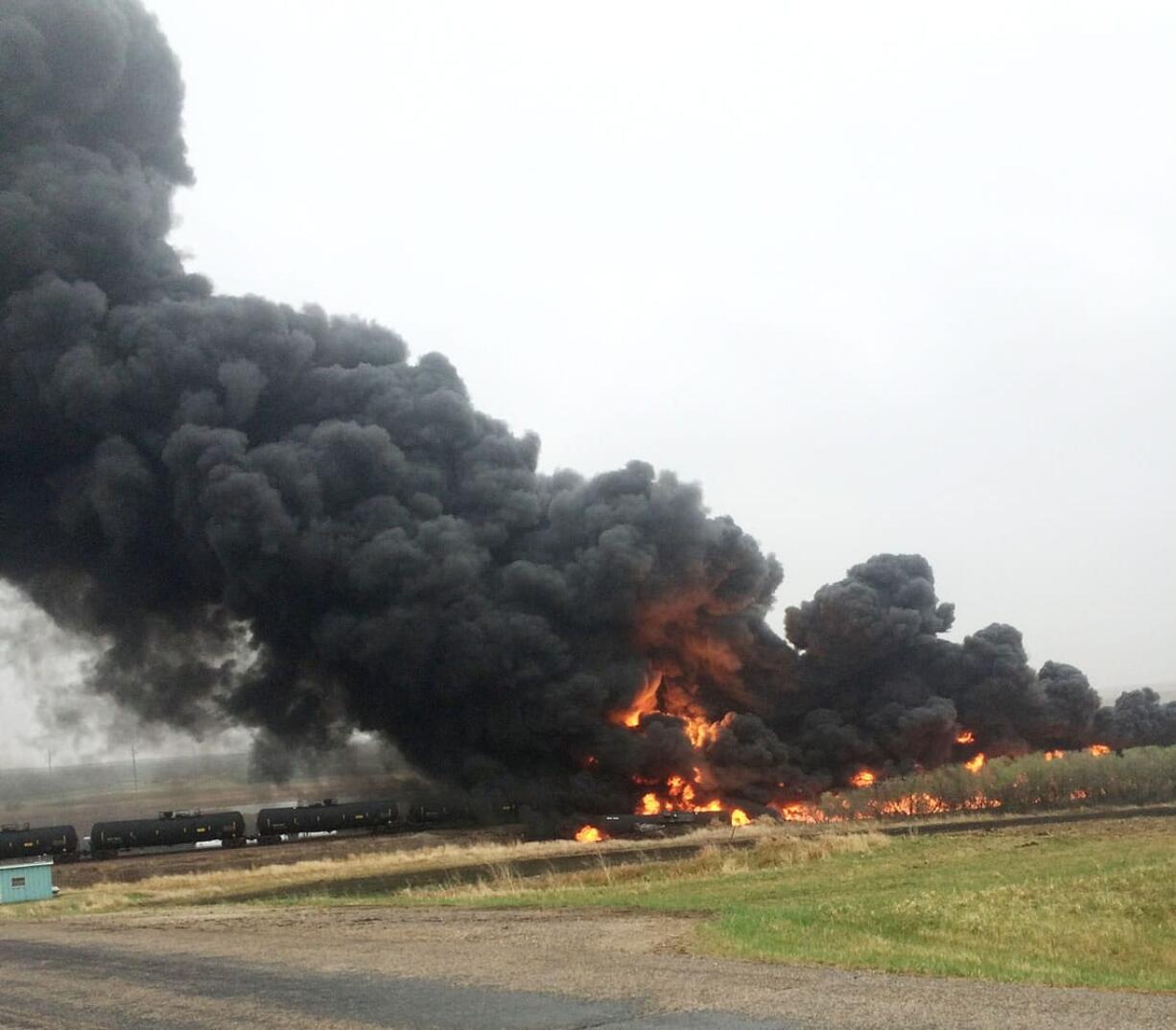 Smoke and fire billow from an oil train that derailed Wednesday in Heimdal, N.D. Ten tanker cars on the BNSF caught fire, prompting the evacuation of Heimdal, where about three dozen people live. No injuries were reported. BNSF Railway is planning to reopen the track Friday.