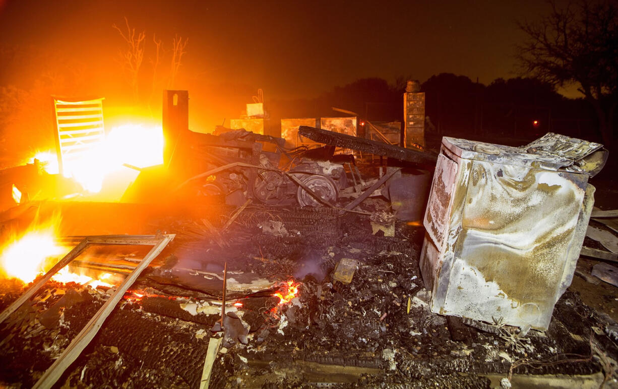 The North Fire destroyed a home Friday on Rattlesnake Road, as the North Fire continues to burn near Interstate 15 in the Cajon Pass in San Bernardino County, Calif.