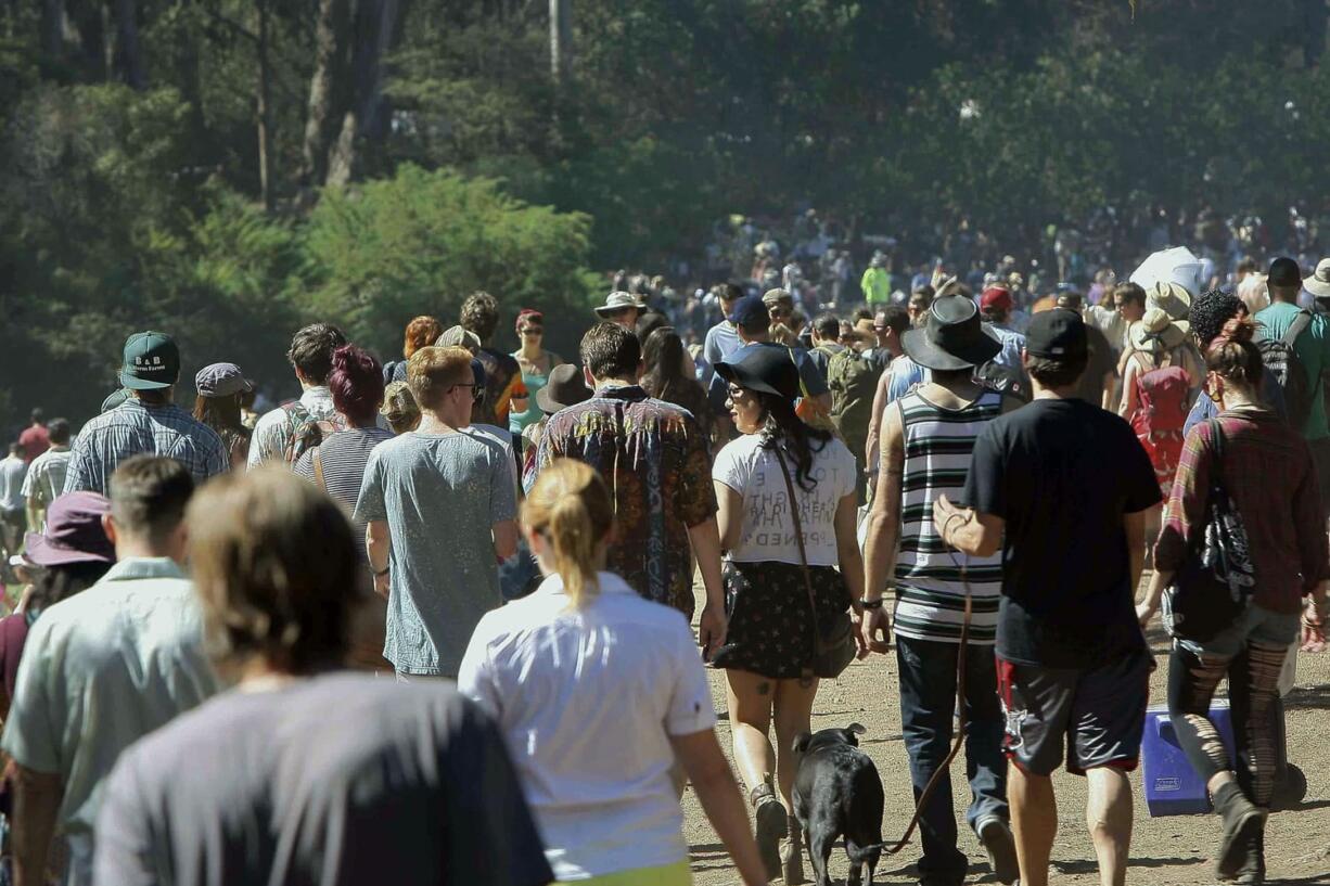 Crowds of people pour in to Golden Gate Park for the second day of the Hardly Strictly Bluegrass Festival, Saturday, Oct. 4, 2014, in San Francisco. As high temperatures were ranging from the low 100s in Southern California to the 90s in the normally more temperate San Francisco Bay Area on Friday, National Weather Service forecasters warned it was just a warm-up for what lies ahead this weekend.