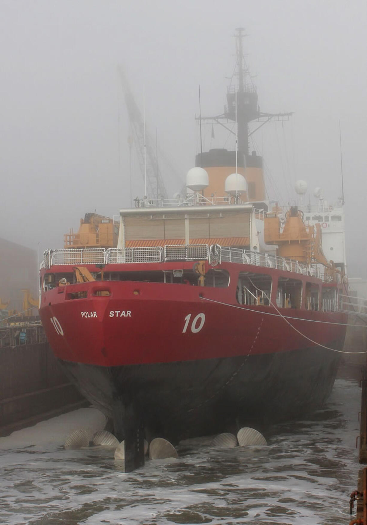 A dry dock containing the icebreaker USS Polar Star is flooded with water on Mare Island in Vallejo, Calif.