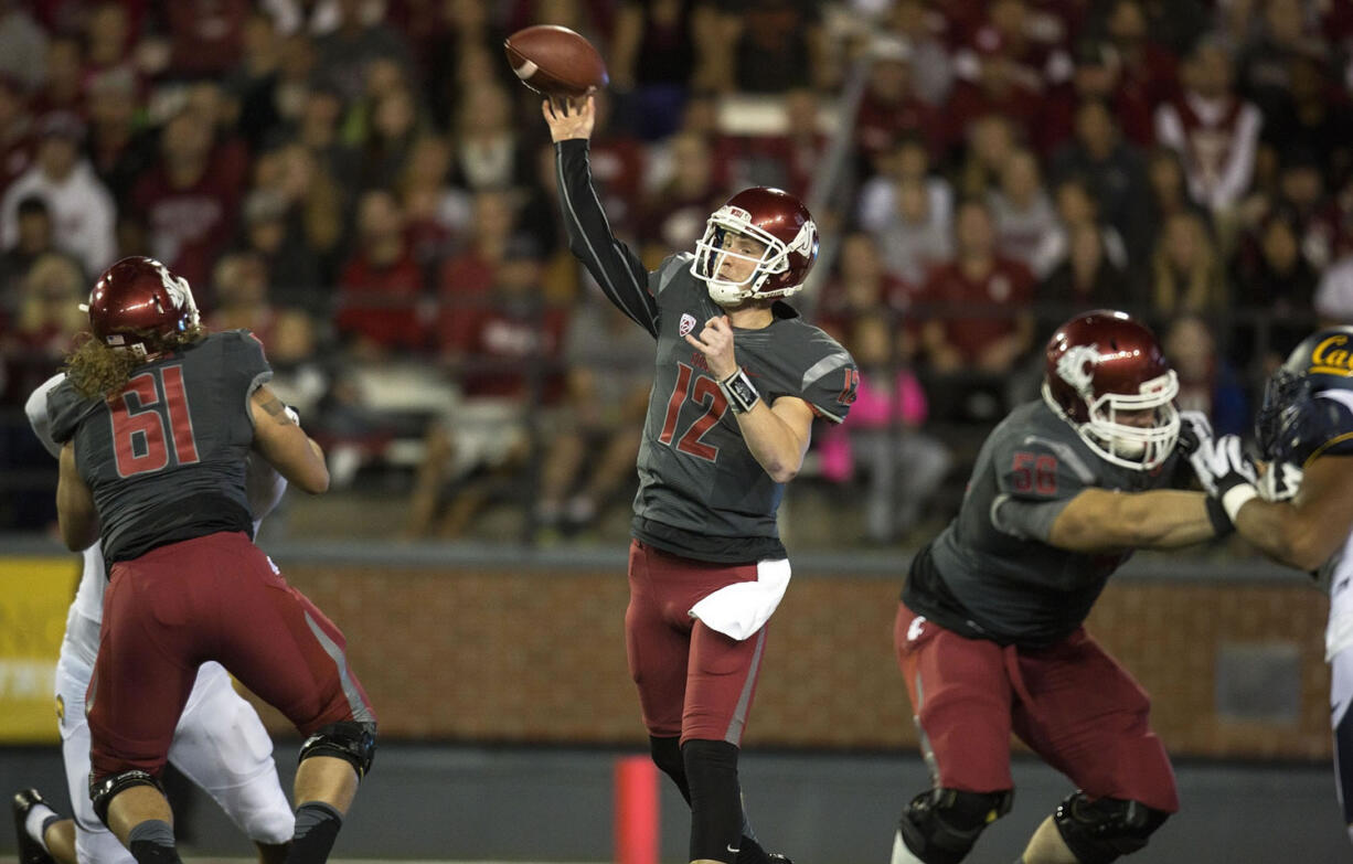 Washington State quarterback Connor Halliday (12) throws a touchdown pass to Vince Mayle against California during the first quarter Saturday, Oct. 4, 2014, at Martin Stadium in Pullman.