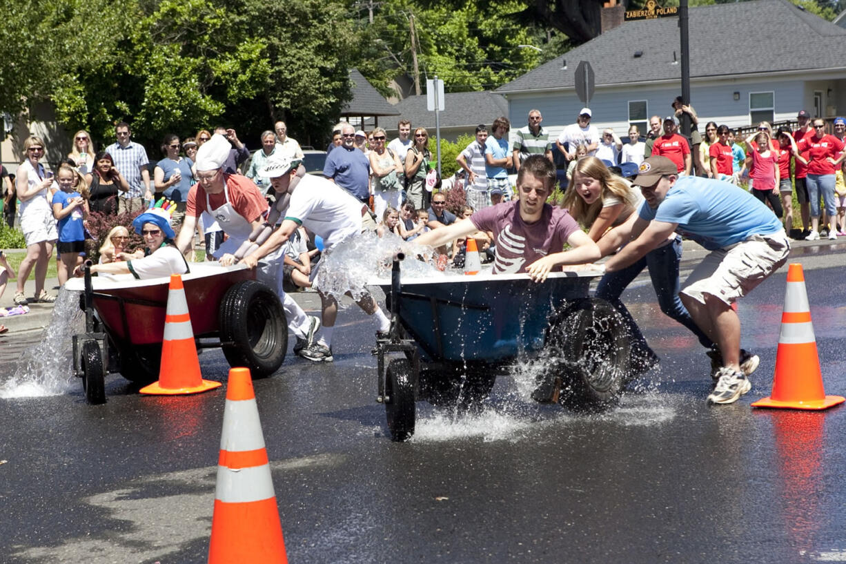 Teams race in the bathtub races at the Camas Days festival.