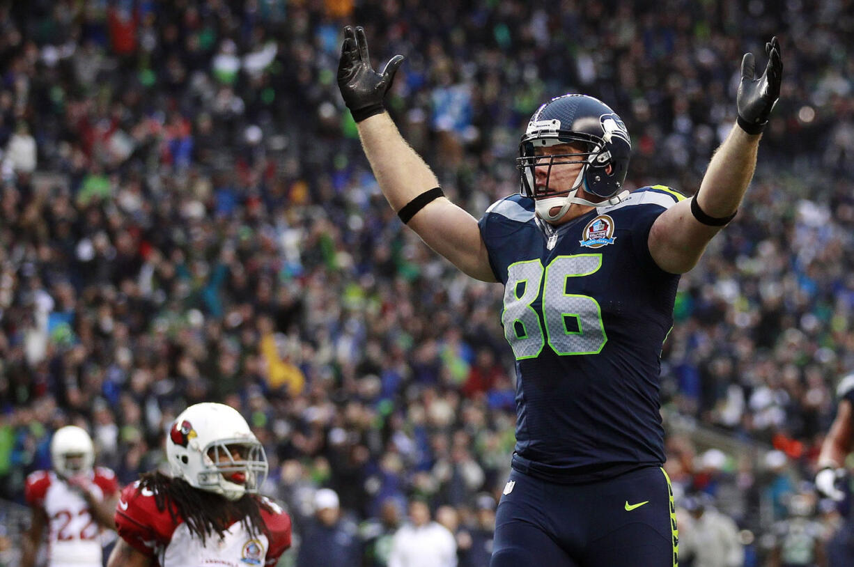 Seattle Seahawks tight end Zach Miller (86) celebrates in front of Arizona Cardinals strong safety Rashad Johnson (49) after scoring on a 24-yard touchdown reception during the second quarter Sunday.