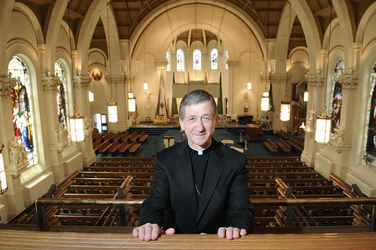 FILE - In this June 30, 2010, file photo, Bishop Blase Cupich, 61, of Rapid City, S.D., poses for a photo at The Cathedral of Our Lady of Lourdes after his announcement in Spokane, Wash. Cupich will be named the next archbishop of Chicago, The Associated Press has learned. Cupich will succeed Cardinal Francis George, according to a person with knowledge of the selection, who spoke Friday, Sept. 19, 2014, on the condition of anonymity because the person wasn't authorized to speak publicly.