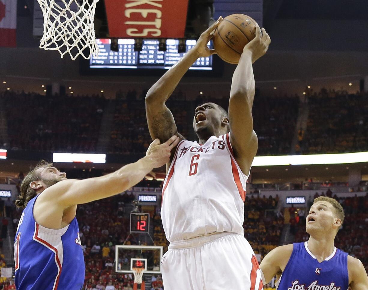 Houston Rockets forward Terrence Jones (6) shoots over Los Angeles Clippers' Spencer Hawes, left, and Blake Griffin (32) during the first half in Game 5 of the Western Conference semifinals. Jones, a Portland native, is backing the Portland Pro-Am summer basketball league, which is set to begin in July. (AP Photo/David J.