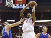 Houston Rockets forward Terrence Jones (6) shoots over Los Angeles Clippers' Spencer Hawes, left, and Blake Griffin (32) during the first half in Game 5 of the Western Conference semifinals. Jones, a Portland native, is backing the Portland Pro-Am summer basketball league, which is set to begin in July. (AP Photo/David J.