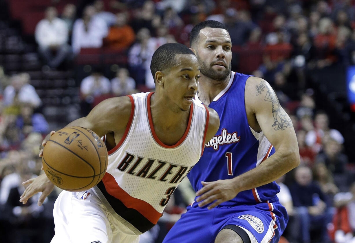 Portland's CJ McCollum, left, scored 19 points Sunday in the Blazers' preseason win.