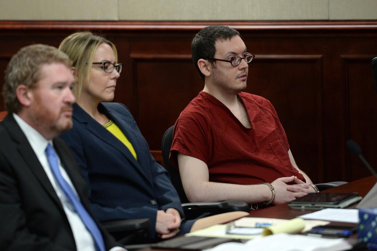 Colorado theatre shooter James Holmes appears in court with his attorneys, Daniel King and Katherine Spengler during sentencing on Wednesday in Centennial, Colo.