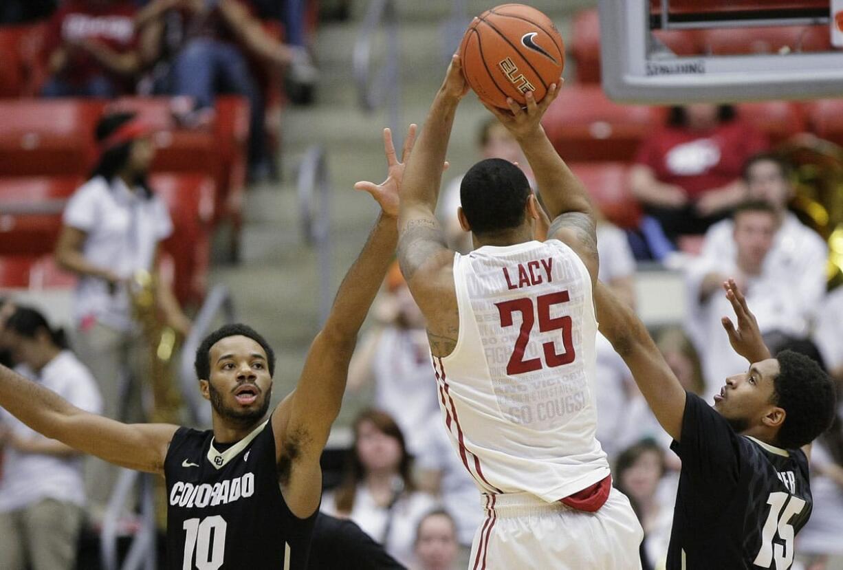 Washington State guard DaVonte' Lacy (25) shoots over Colorado guards Tre'Shaun Fletcher (10) and Dominique Collier (15) during the first half Saturday, March 7, 2015, in Pullman.