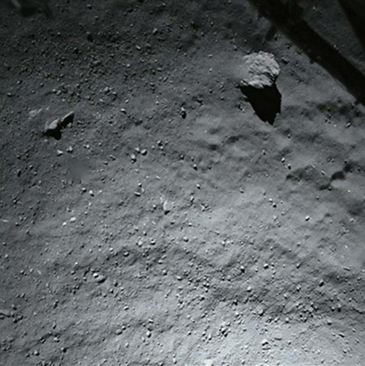 This image released by the European Space Agency ESA Thursday was taken by Philae's down-looking descent ROLIS imager when it was about 40 meters above the surface of Comet 67P/Churyumov-Gerasimenko Wednesday.