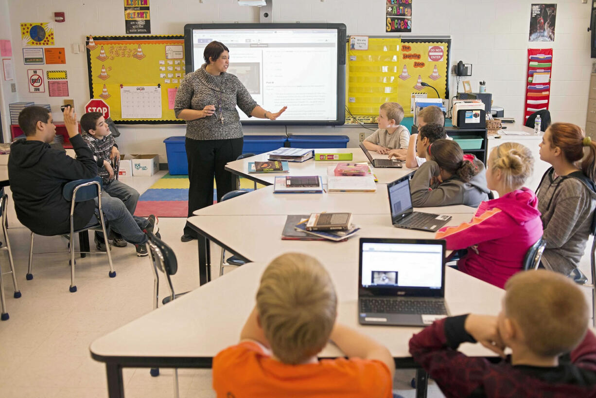 Sixth-grade teacher Carrie Young guides her students through a practice exercise for the Common Core State Standards Test on Feb.12  at Morgan Elementary School South in Stockport, Ohio.