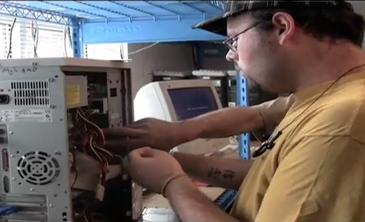 Student technician James Panter works on a computer as part of Clark College's Student Run Help Desk.