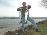 Angler Dick Borneman of Vancouver with a pair of coho caught in mid-October in the Columbia River at the mouth of the Cowlitz River.