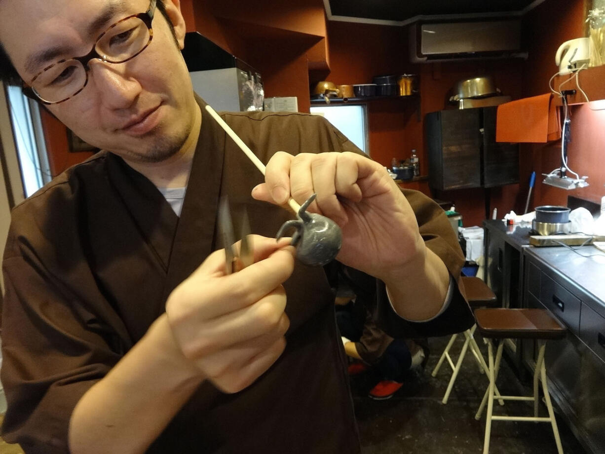 At Amezaiku Yoshihara in Tokyo, Takahiro Yoshihara takes a glob of sugar syrup, adds a drop of coloring, and quickly works it into an incredibly detailed little candy creature, using only his fingers and a small pair of steel scissors.