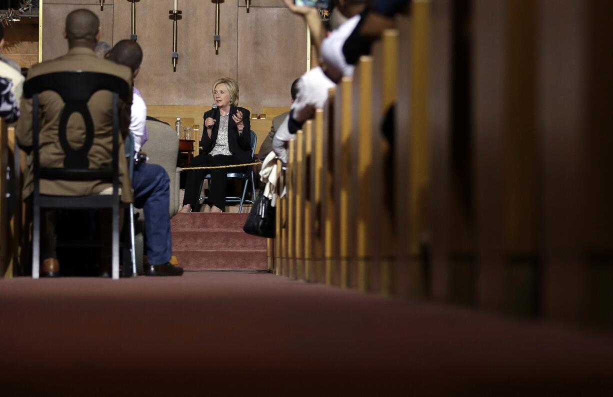 Democratic presidential candidate Hillary Rodham Clinton takes part in a panel discussion during a campaign stop at Christ the King United Church of Christ on Tuesday in Florissant, Mo.