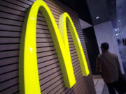 A man walks by a McDonald's restaurant in Tokyo.