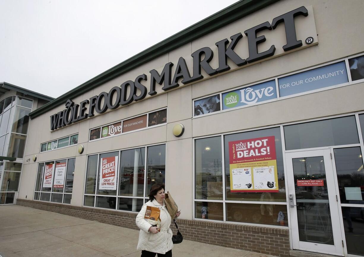 A woman walks out of the Whole Foods Market in Woodmere Village, Ohio.