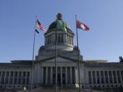 The flag of Washington State University flies in front of the state Capitol in honor of the school's late president, Elson Floyd on June 25 in Olympia.