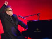 Elton John performs at the Elton John AIDS Foundation's 13th Annual &quot;An Enduring Vision&quot; benefit at Cipriani's Wall Street on Tuesday in New York.