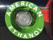 An American Ethanol label is shown Nov. 1, 2014, on a NASCAR race car gas tank at Texas Motor Speedway in Fort Worth, Texas. The Obama administration is proposing to reduce the amount of ethanol blended in the nation's gasoline, a blow to renewable fuel companies that have pushed to keep high volumes of their product flowing into drivers' gas tanks. The move is unlikely to mean much for consumers or prices at the pump.