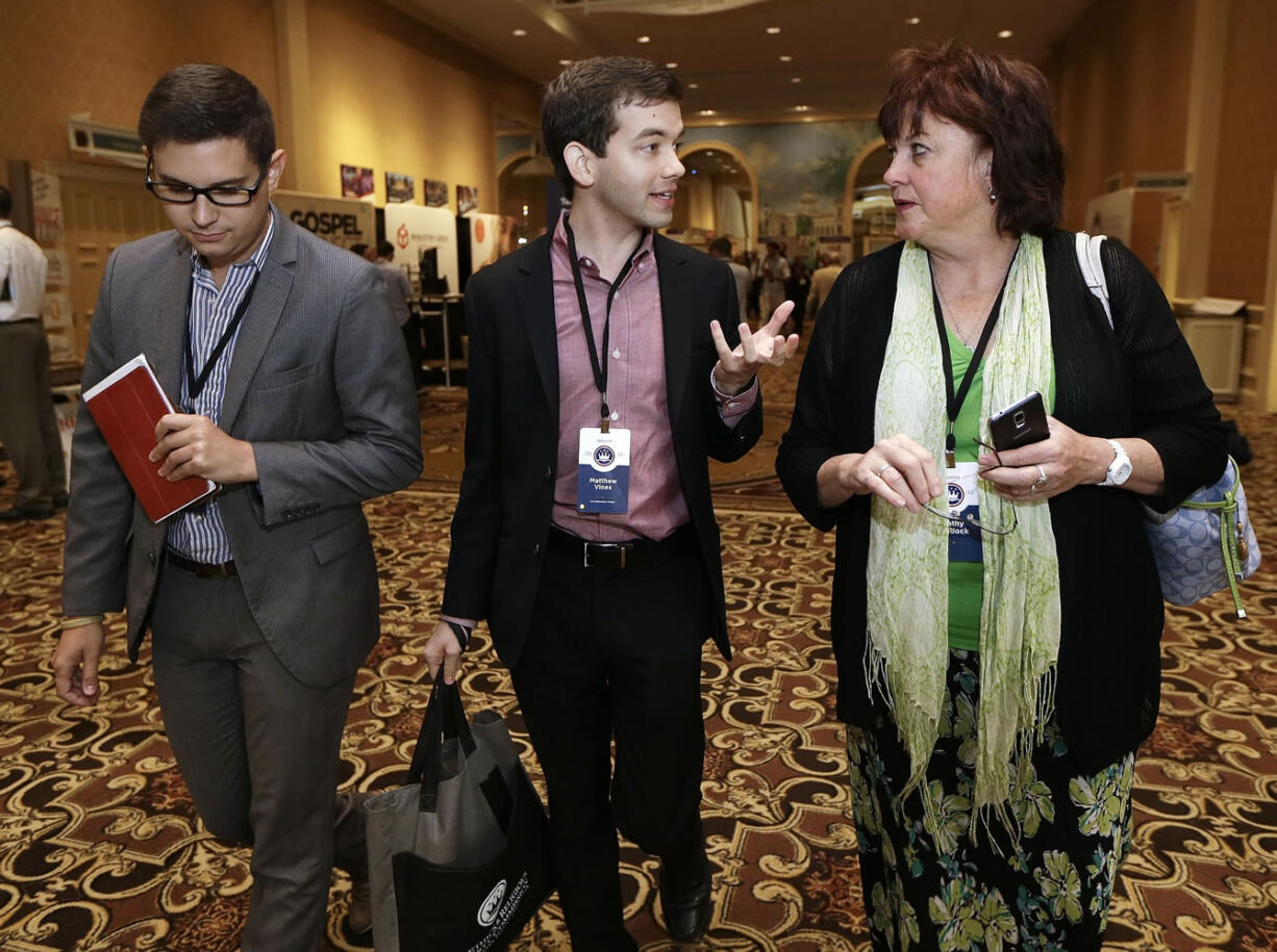 Photos by Mark Humphrey/Associated Press
Matthew Vines, center, author of &quot;God and the Gay Christian,&quot; talks with Devin Kennamer, left, and Kathy Baldock on Tuesday at the Ethics and Religious Liberty Commission National Conference in Nashville, Tenn. Southern Baptists organized the three-day event to strengthen the resolve of Christians preaching the increasingly unpopular view that gay relationships are sinful.