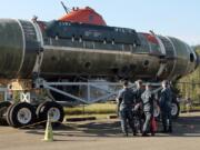 Sailors from Naval Base Kitsap Bangor take a look at the DSRV Mystic on display at the Naval Undersea Museum in Keyport on Thursday.