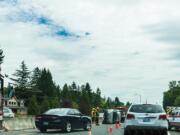 Emergency crews respond to a truck that rolled onto its side late Sunday morning on state Highway 14 in Vancouver.