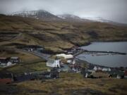 Cloudy skies hang over the hills overlooking the town of Eidi in the north of the Faeroe Islands on Thursday.